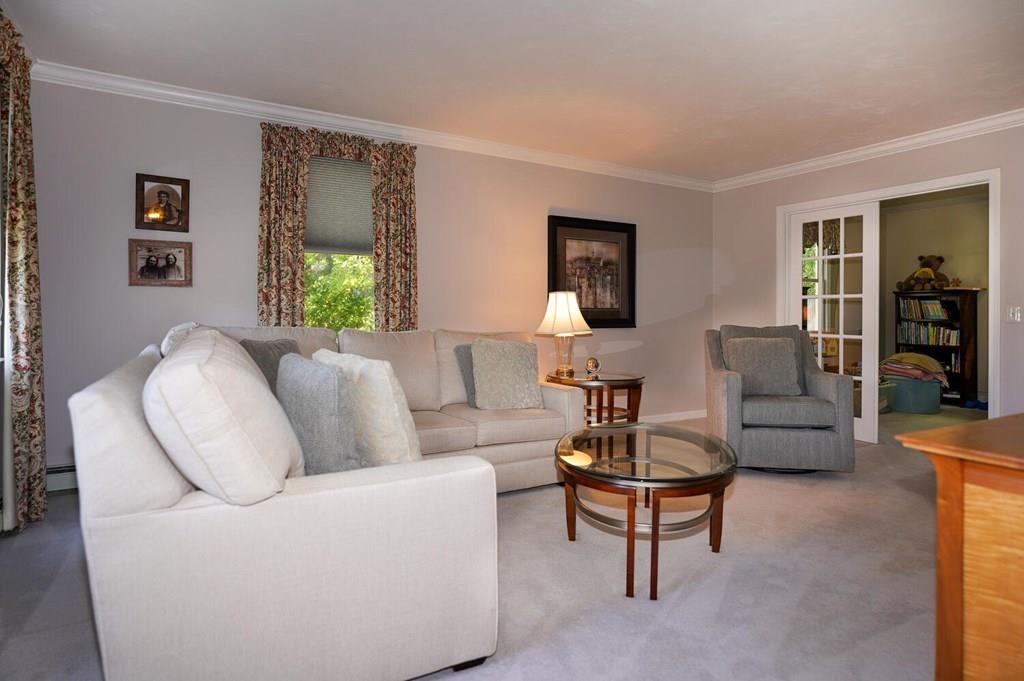 230 Simpson Road Marlborough, MA 01752 - Photo 11 of 32 a living room with furniture and a potted plant