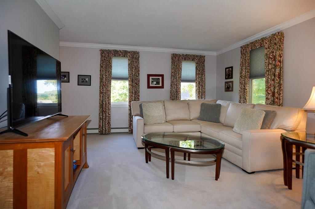 230 Simpson Road Marlborough, MA 01752 - Photo 13 of 32 a living room with furniture and a flat screen tv