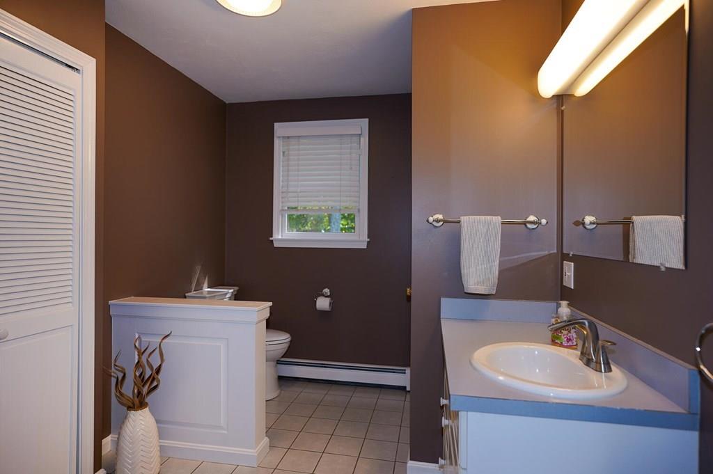 230 Simpson Road Marlborough, MA 01752 - Photo 15 of 32 a bathroom with a sink and a mirror