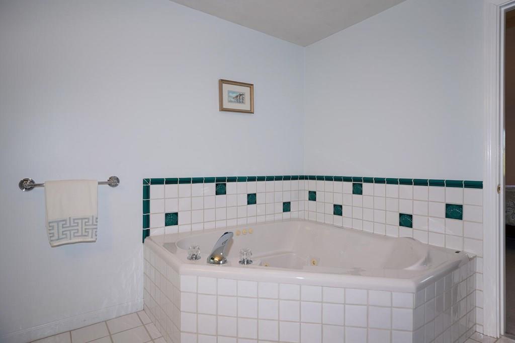 230 Simpson Road Marlborough, MA 01752 - Photo 21 of 32 a bath tub sitting next to a white sink