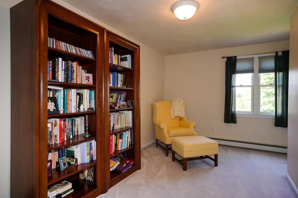 230 Simpson Road Marlborough, MA 01752 - Photo 24 of 32 a bedroom with furniture and a book shelf
