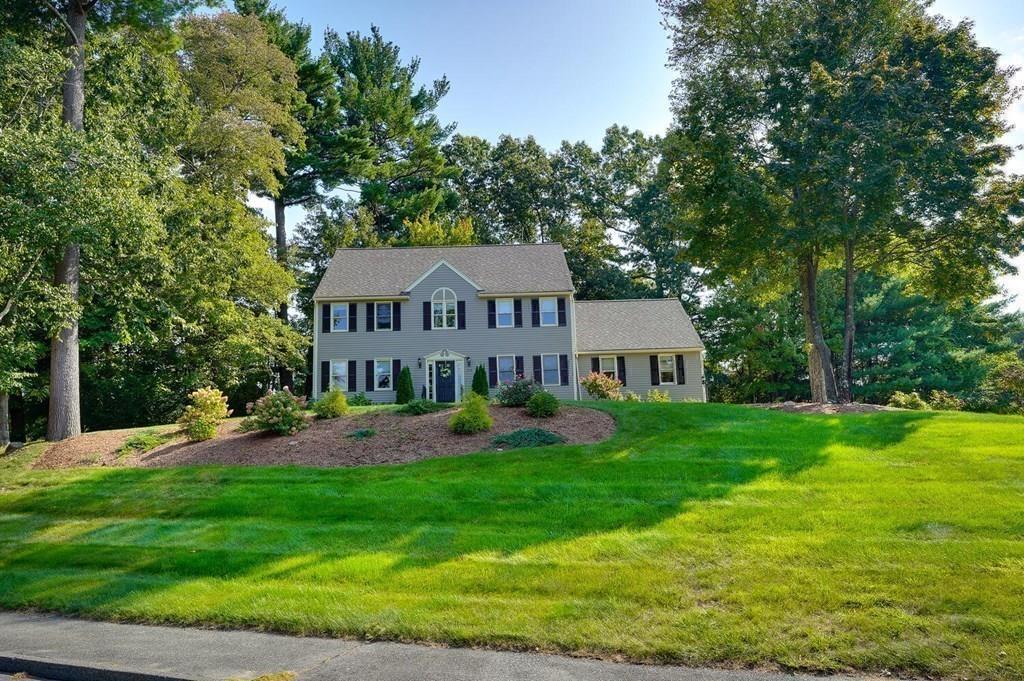 230 Simpson Road Marlborough, MA 01752 - Photo 32 of 32 a view of a house with a big yard potted plants and large tree