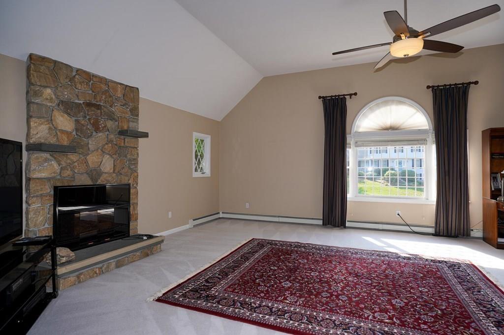 230 Simpson Road Marlborough, MA 01752 - Photo 6 of 32 a view of empty room with front door and a fireplace