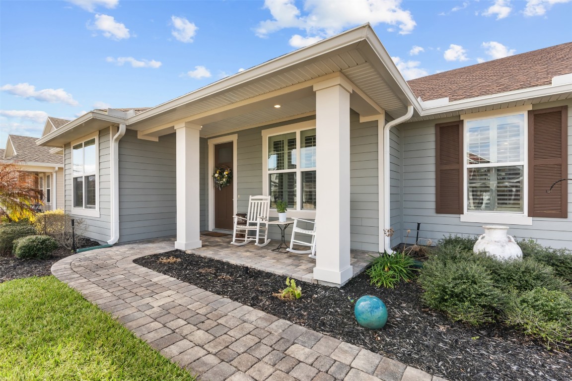 93322 Sandown Drive Fernandina Beach, FL 32034 - Photo 1 of 40 a front view of a house with garden