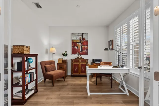 a room with furniture a rug and a window