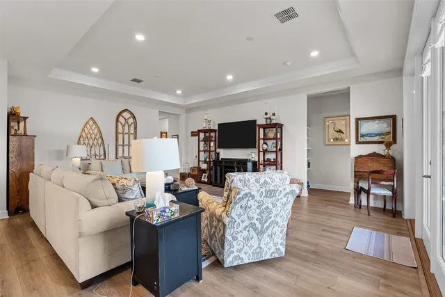 a living room with fireplace furniture and a flat screen tv