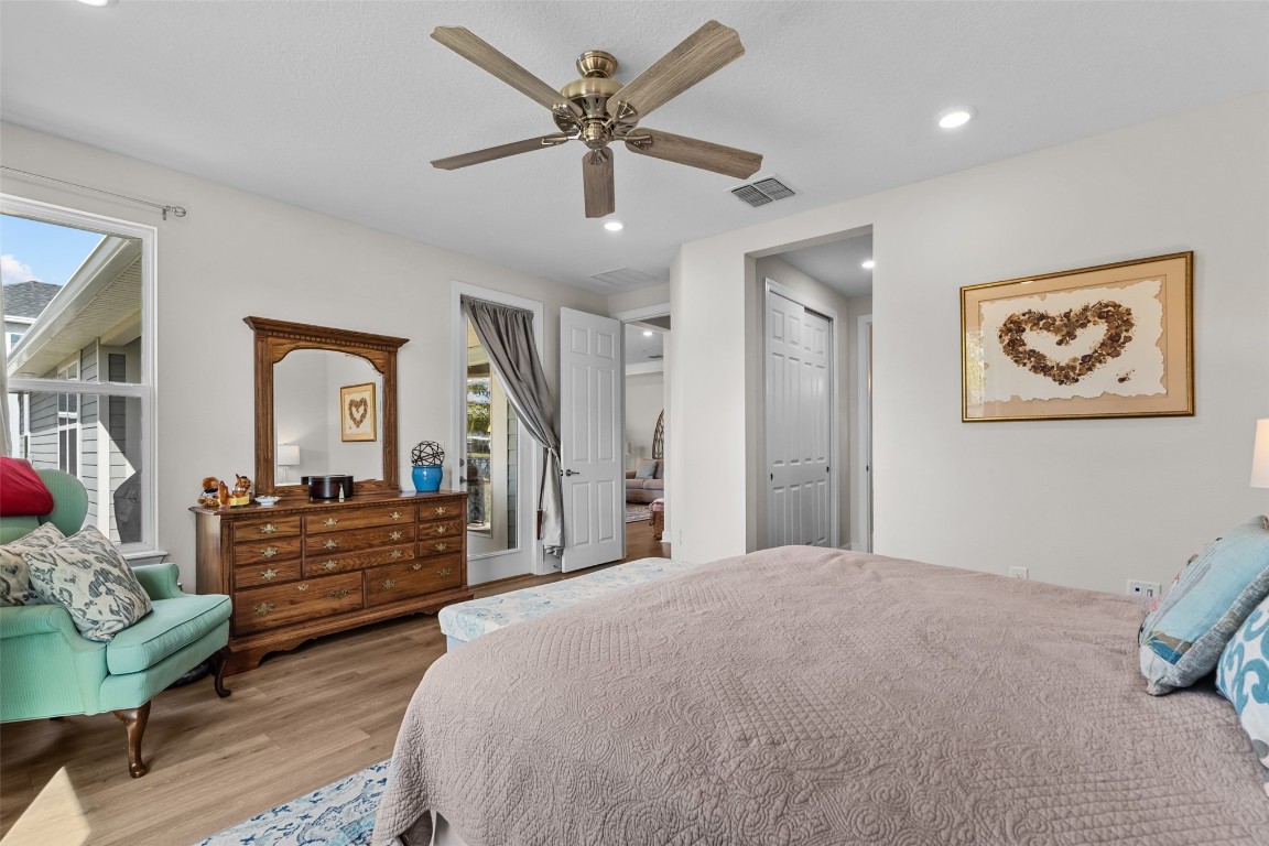 93322 Sandown Drive Fernandina Beach, FL 32034 - Photo 27 of 40 a spacious bedroom with a bed and a dresser