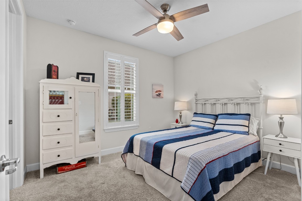 93322 Sandown Drive Fernandina Beach, FL 32034 - Photo 32 of 40 a bedroom with a bed and a window