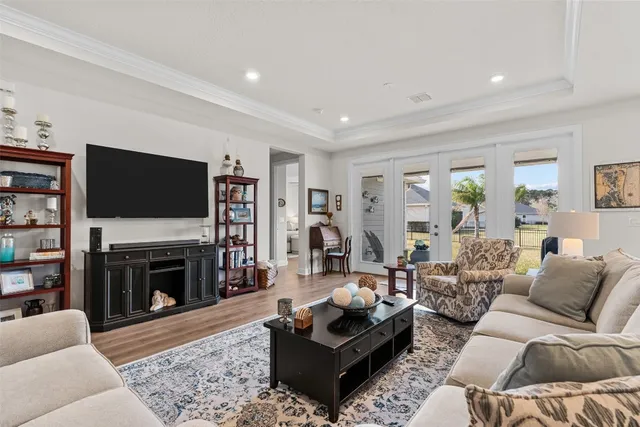 a living room with fireplace furniture and a flat screen tv