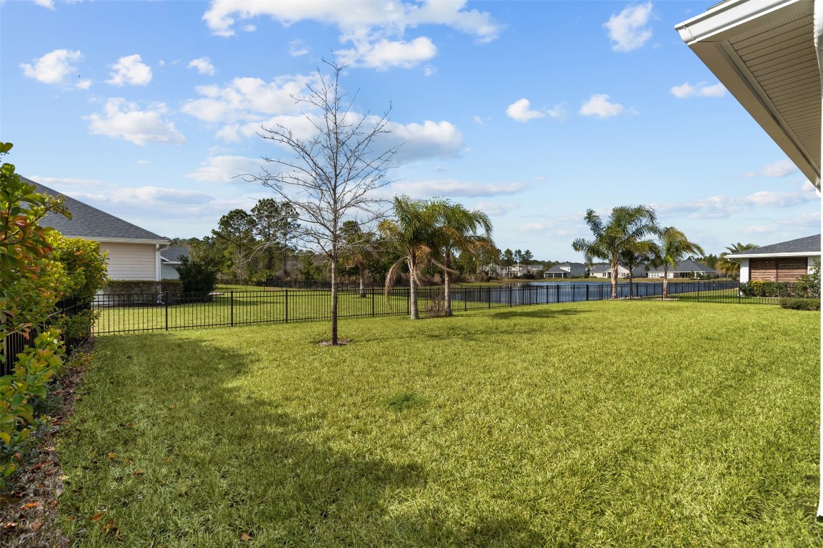 93322 Sandown Drive Fernandina Beach, FL 32034 - Photo 9 of 40 a view of a golf course with a big yard