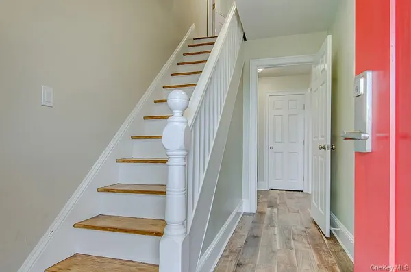 a view of entryway with wooden floor