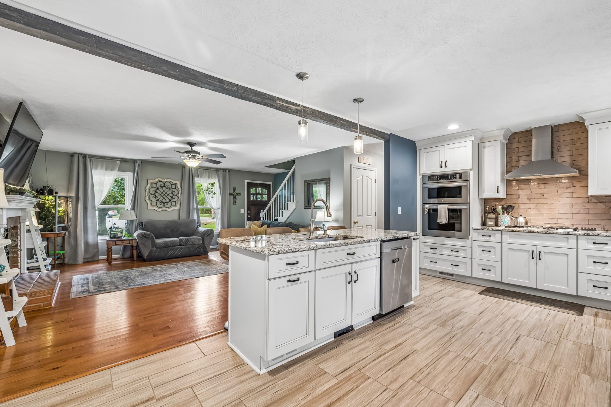 3516 Laurel Court Murfreesboro, TN 37129 - Photo 17 of 65 a large kitchen with stainless steel appliances lots of counter space and wooden floors