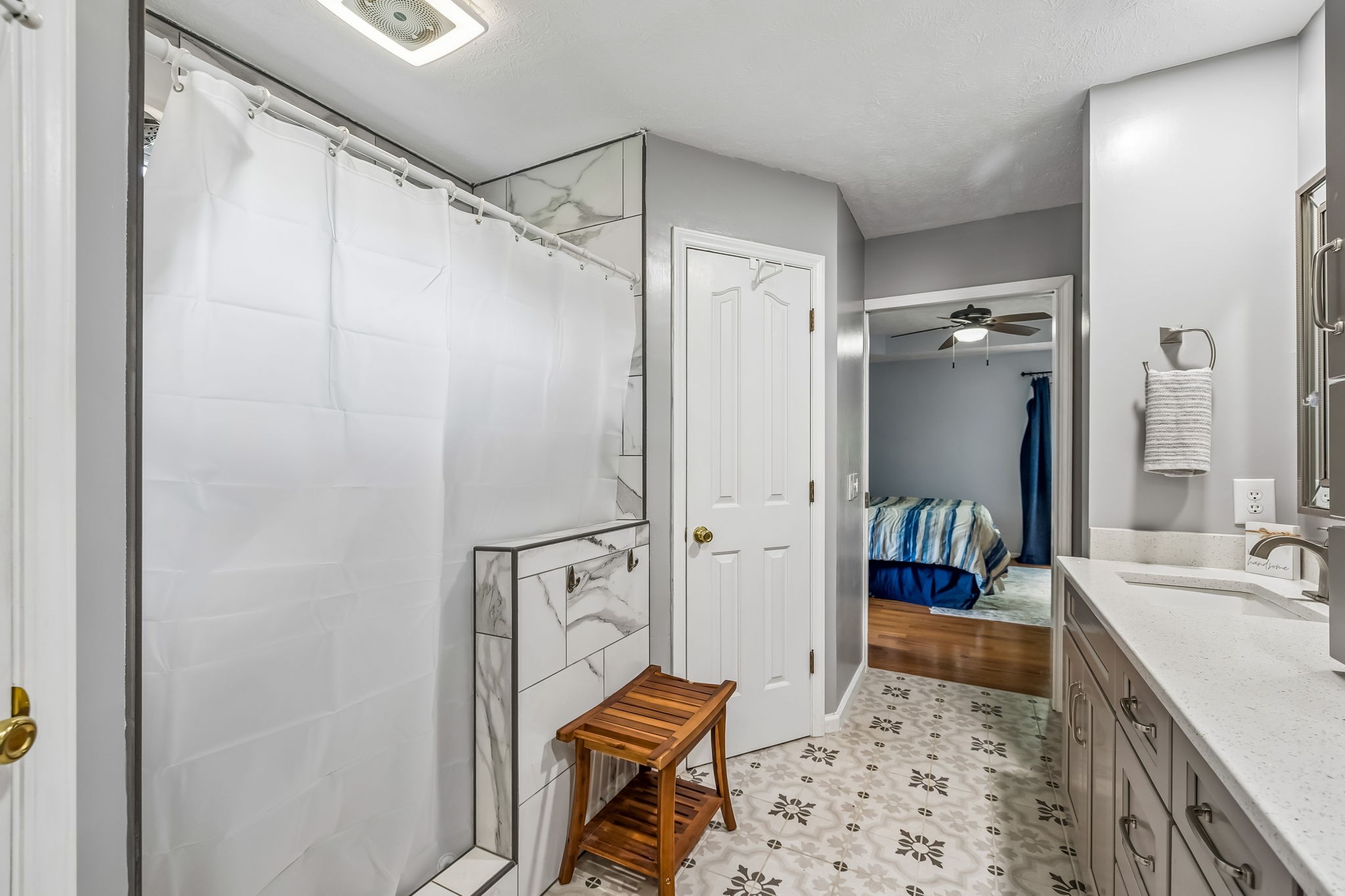 3516 Laurel Court Murfreesboro, TN 37129 - Photo 24 of 65 a bathroom with a tub shower sink and mirror