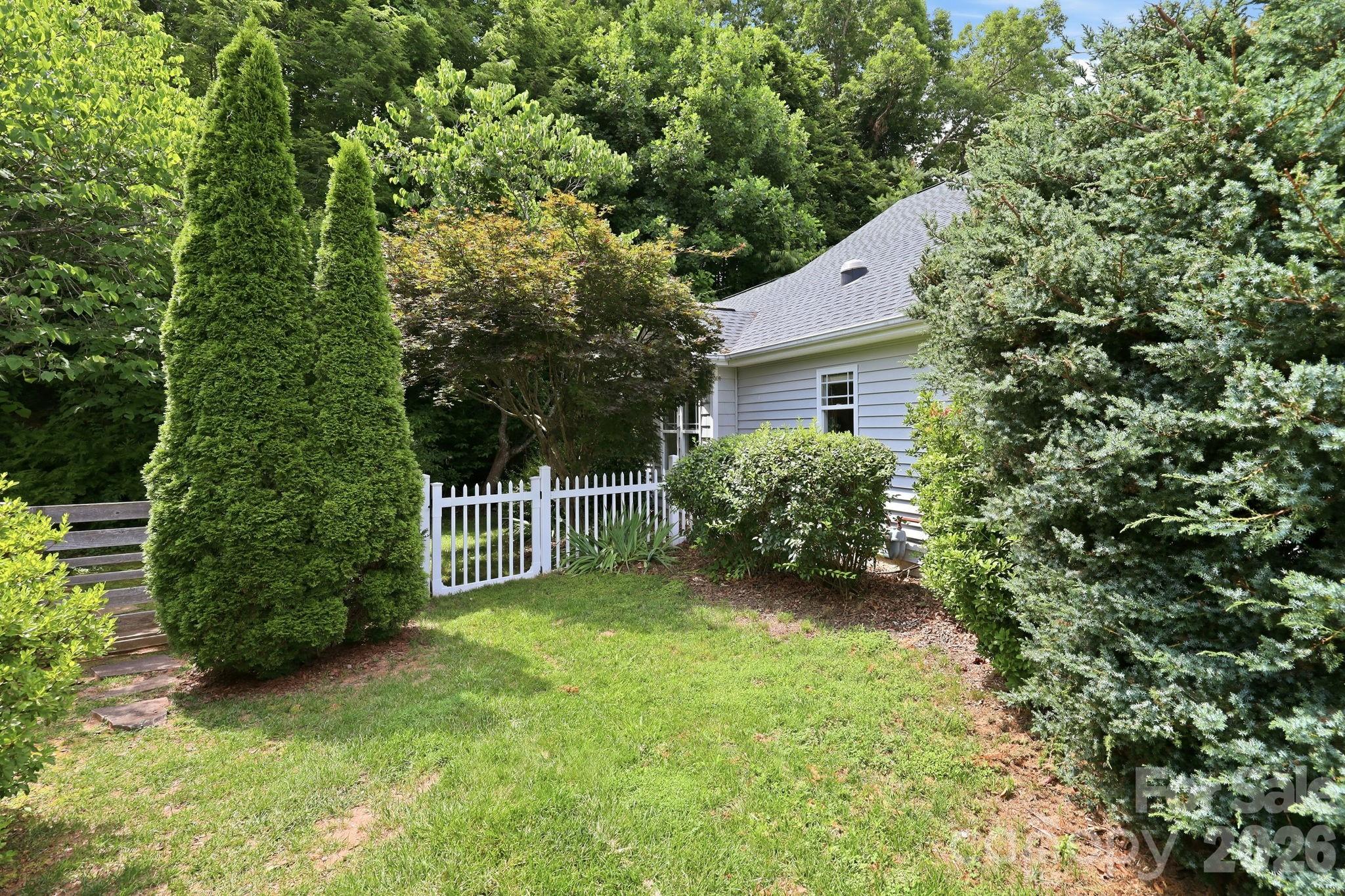 51 Sunview Circle Arden, NC 28704 - Photo 26 of 31 a view of a house with a small yard and large trees