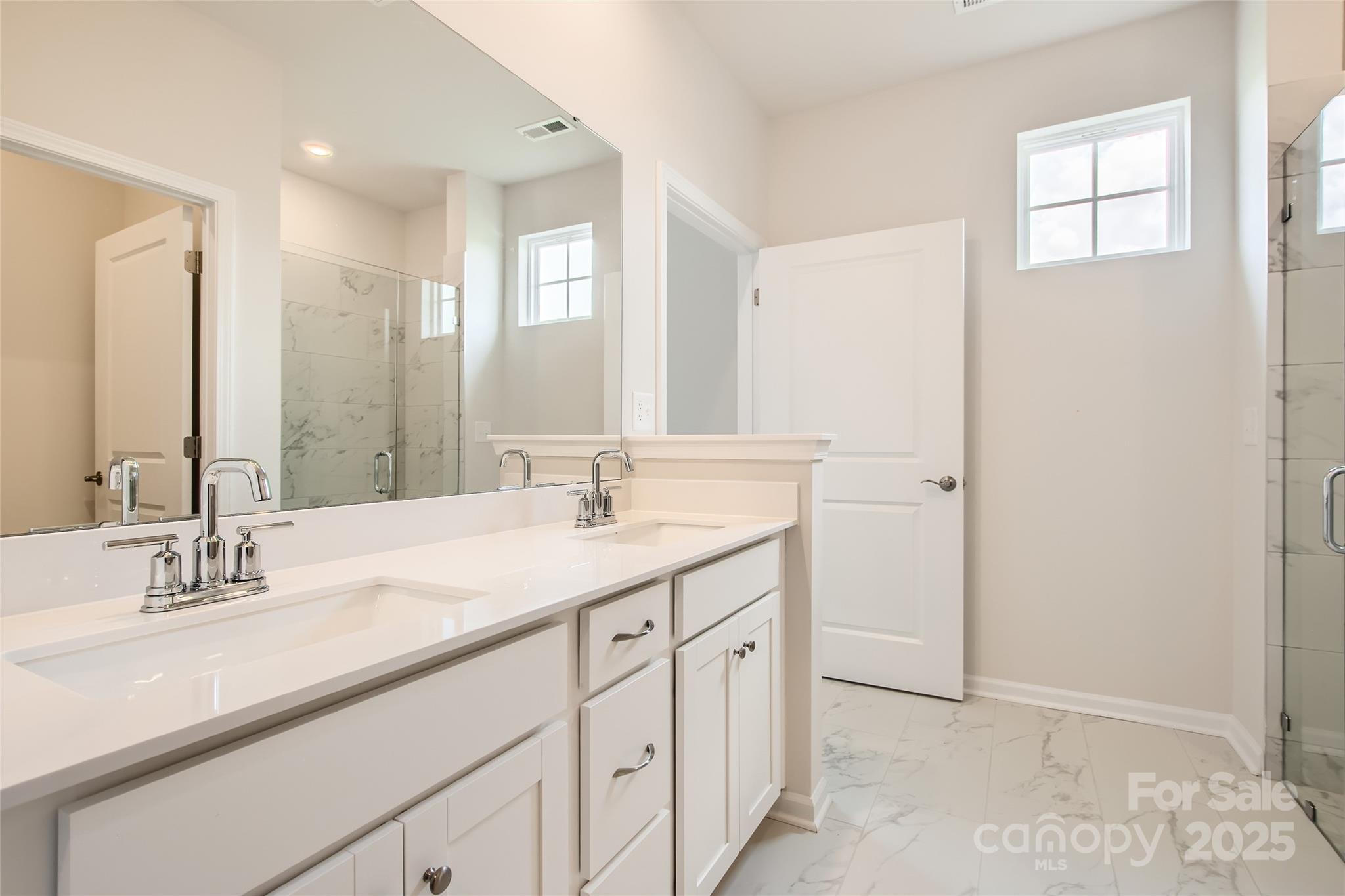 8473 Norman Frst Road Lancaster, SC 29720 - Photo 8 of 18 a bathroom with double sink and a mirror