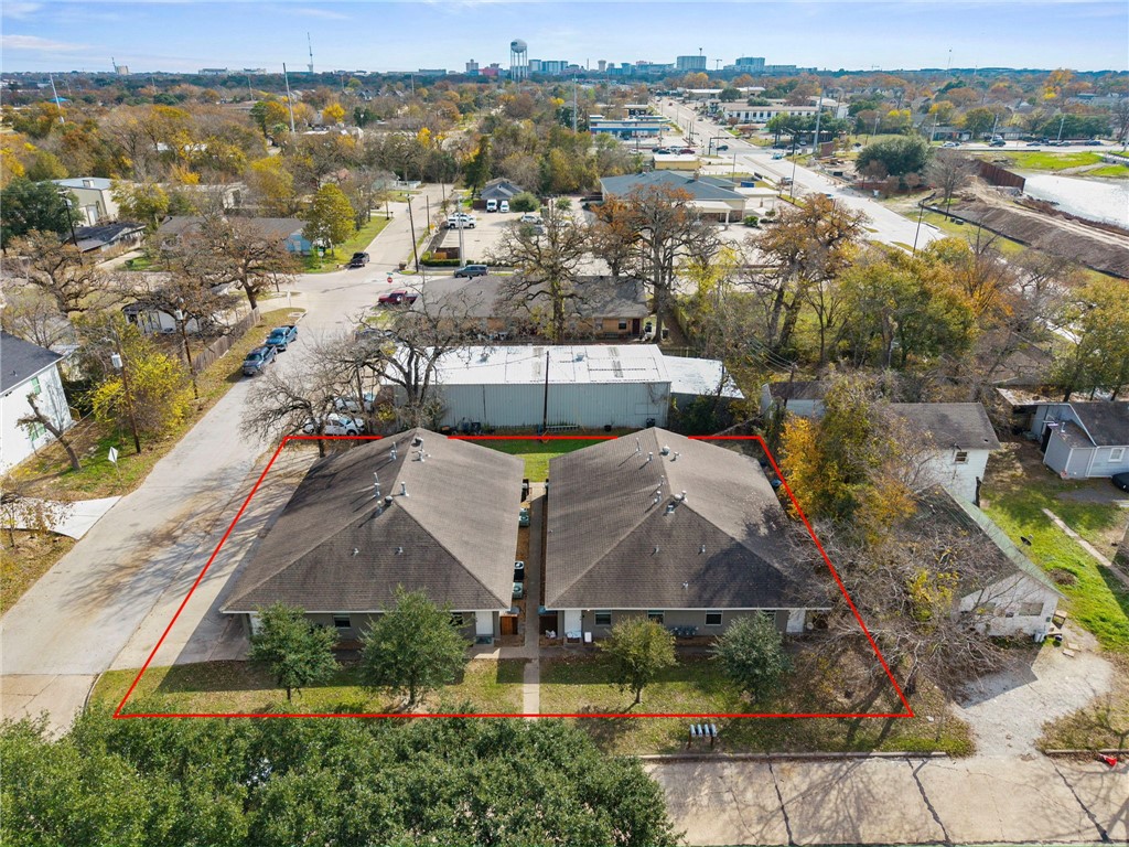 105-107 Davis Street Bryan, TX 77801 - Photo 1 of 14 an aerial view of residential houses with outdoor space