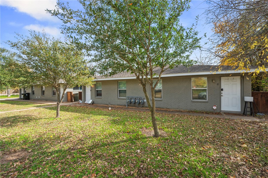 105-107 Davis Street Bryan, TX 77801 - Photo 5 of 14 a view of a house with a yard