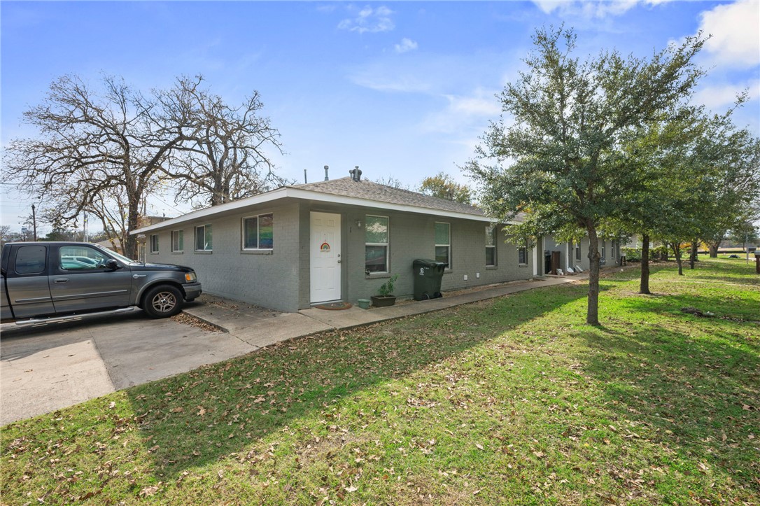 105-107 Davis Street Bryan, TX 77801 - Photo 7 of 14 a view of a house with a yard