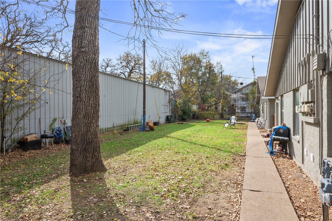 105-107 Davis Street Bryan, TX 77801 - Photo 8 of 14 a view of a yard with a tree