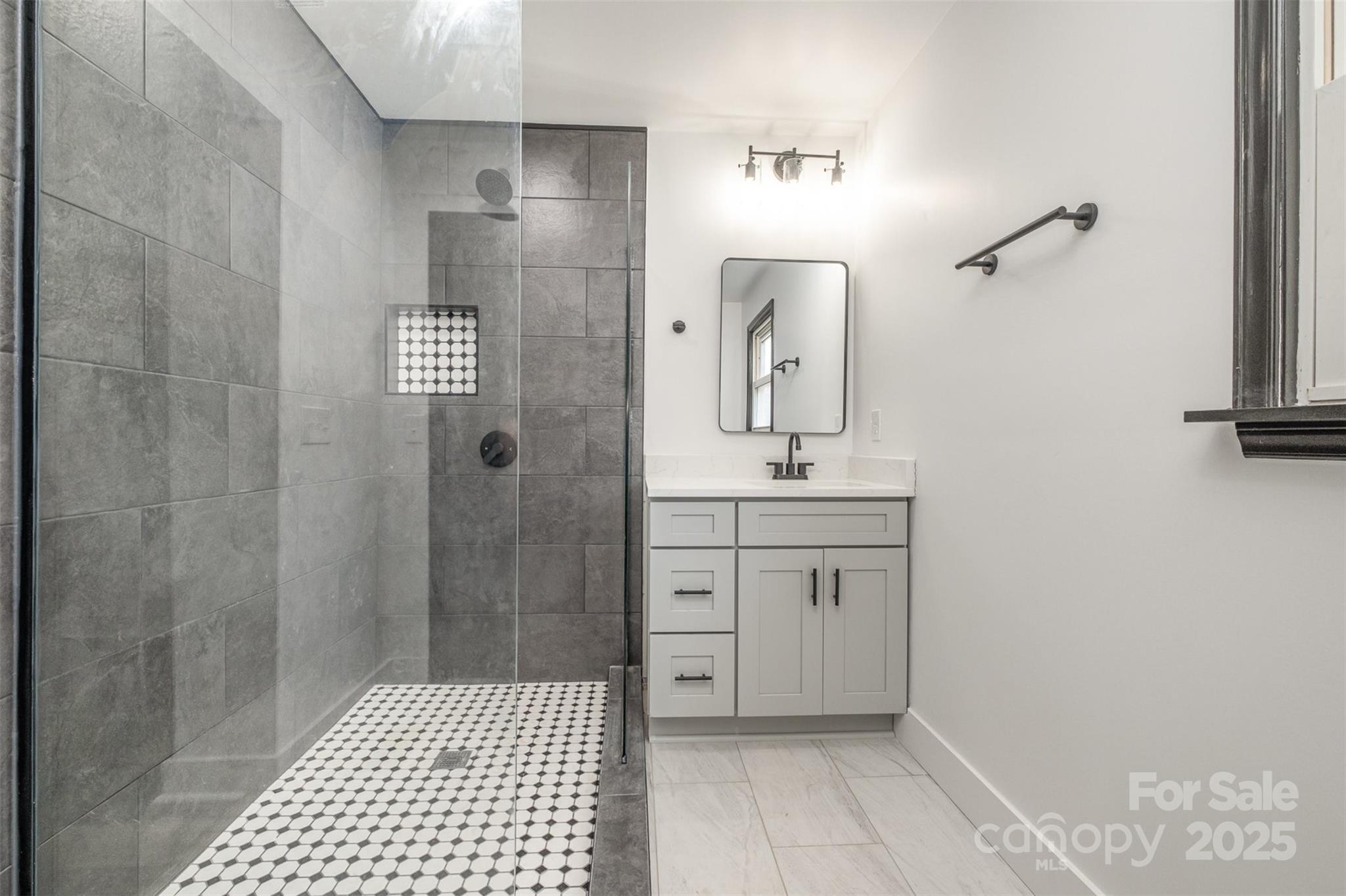 5674 Alan D Good Lane Conover, NC 28613 - Photo 15 of 21 a bathroom with a sink a toilet a shower and a mirror