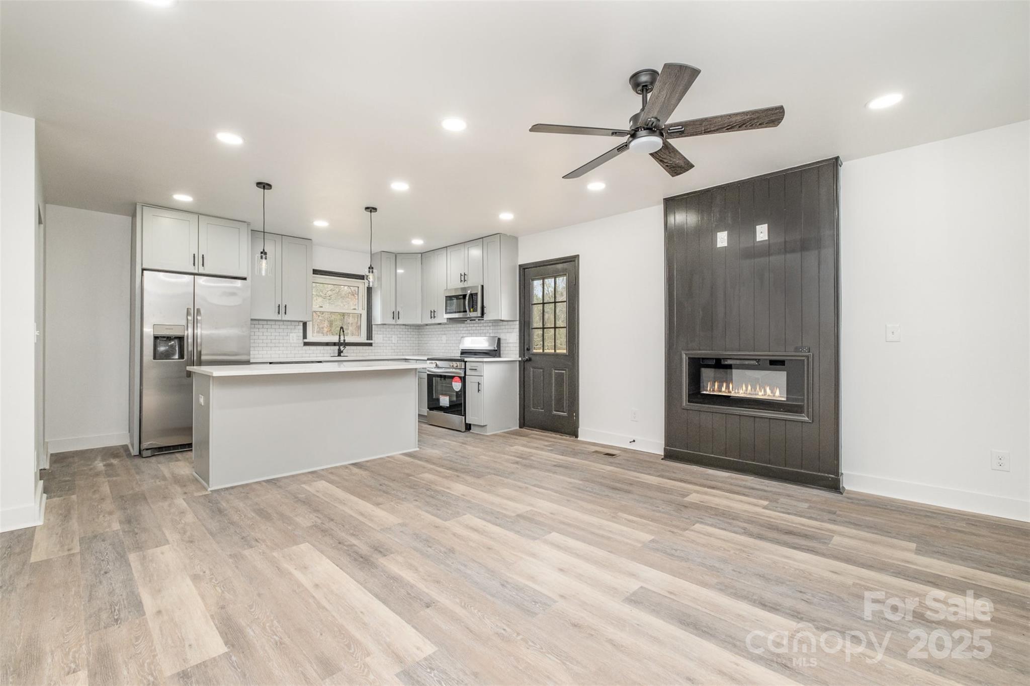 5674 Alan D Good Lane Conover, NC 28613 - Photo 7 of 21 a view of kitchen with wooden floor and window