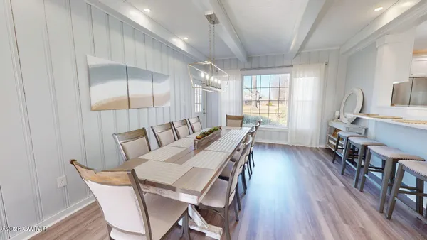 a view of a dining room with furniture window and wooden floor