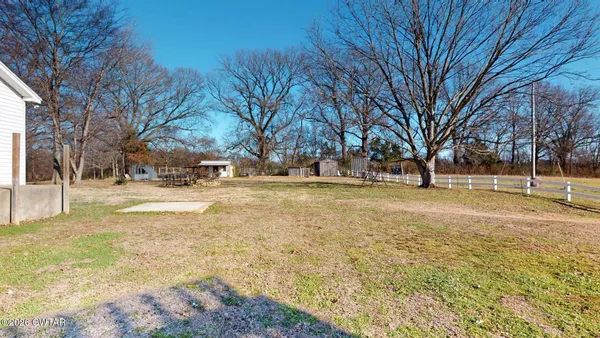 a view of yard with trees