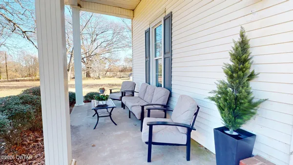a view of a patio with furniture