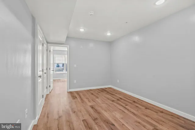 a view of hallway with wooden floor