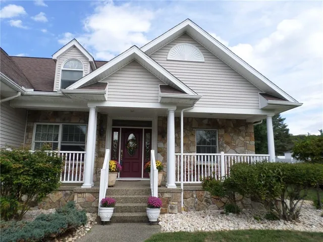 a front view of a house with a porch