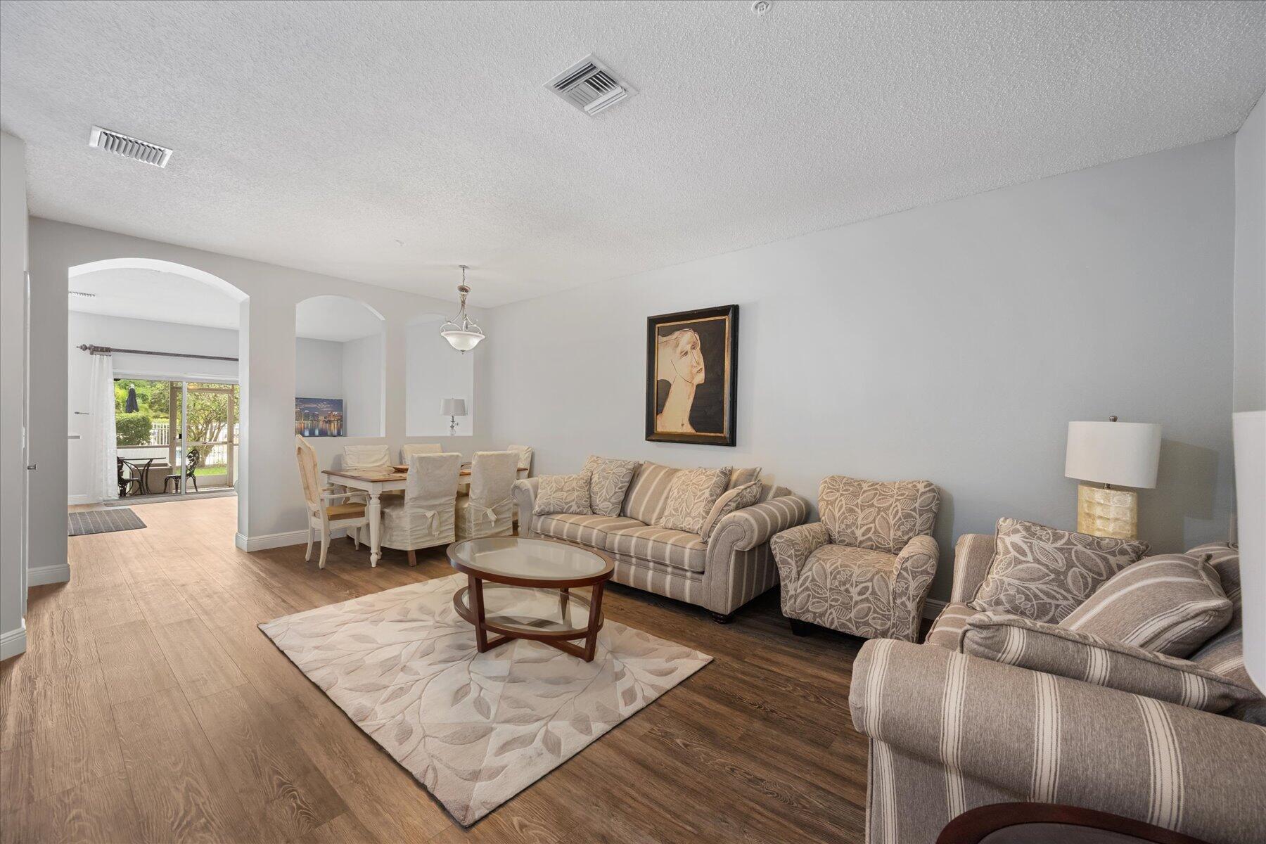 112 Lighthouse Circle, Unit G Tequesta, FL 33469 - Photo 4 of 27 a living room with furniture and a couch
