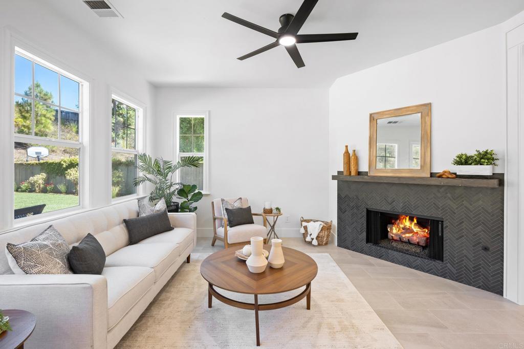 1653 Reflection Street San Marcos, CA 92078 - Photo 13 of 68 a living room with furniture and a fireplace