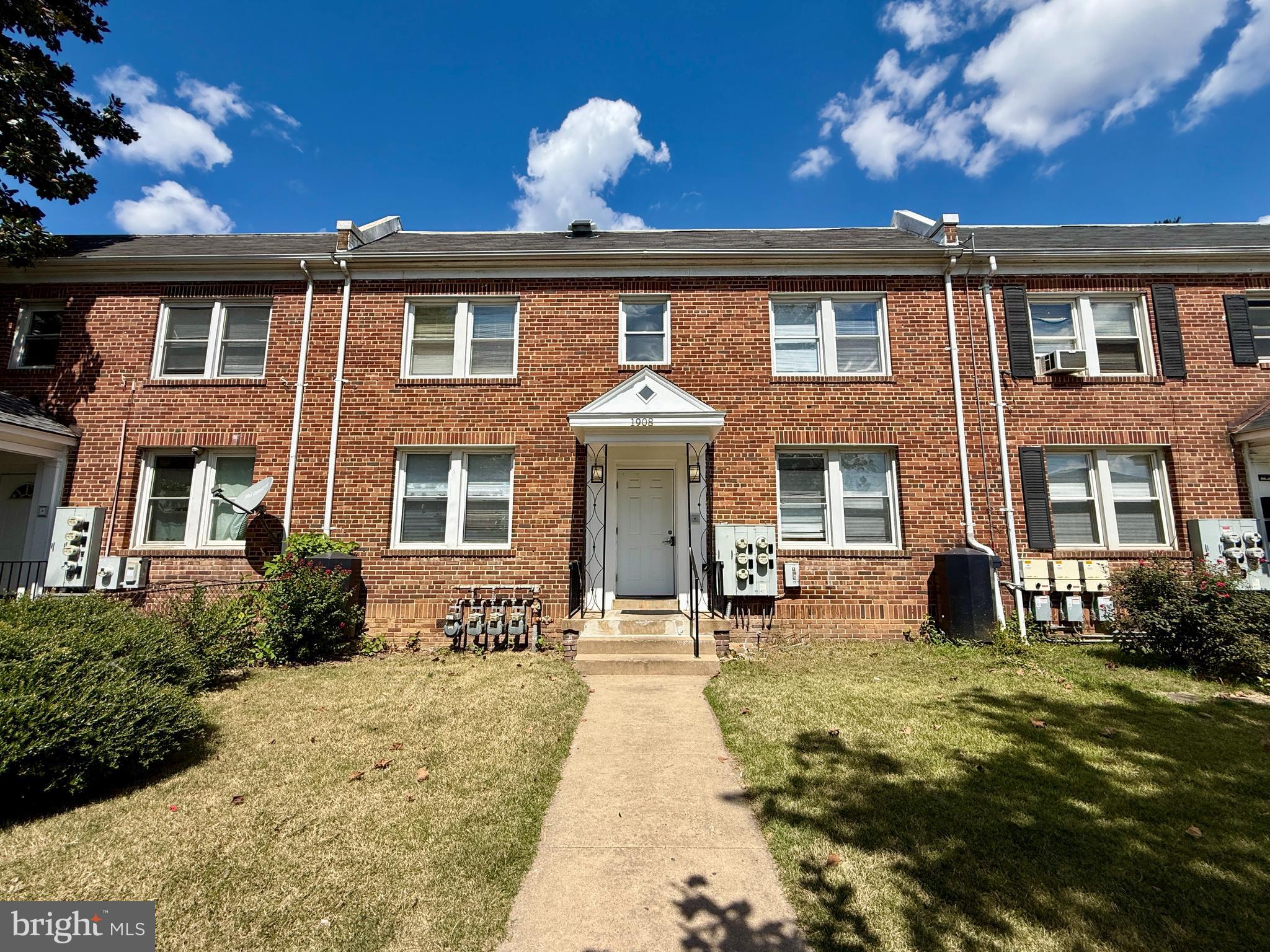 1908 M Street Northeast Washington, DC 20002 - Photo 1 of 20 a front view of a house with a yard