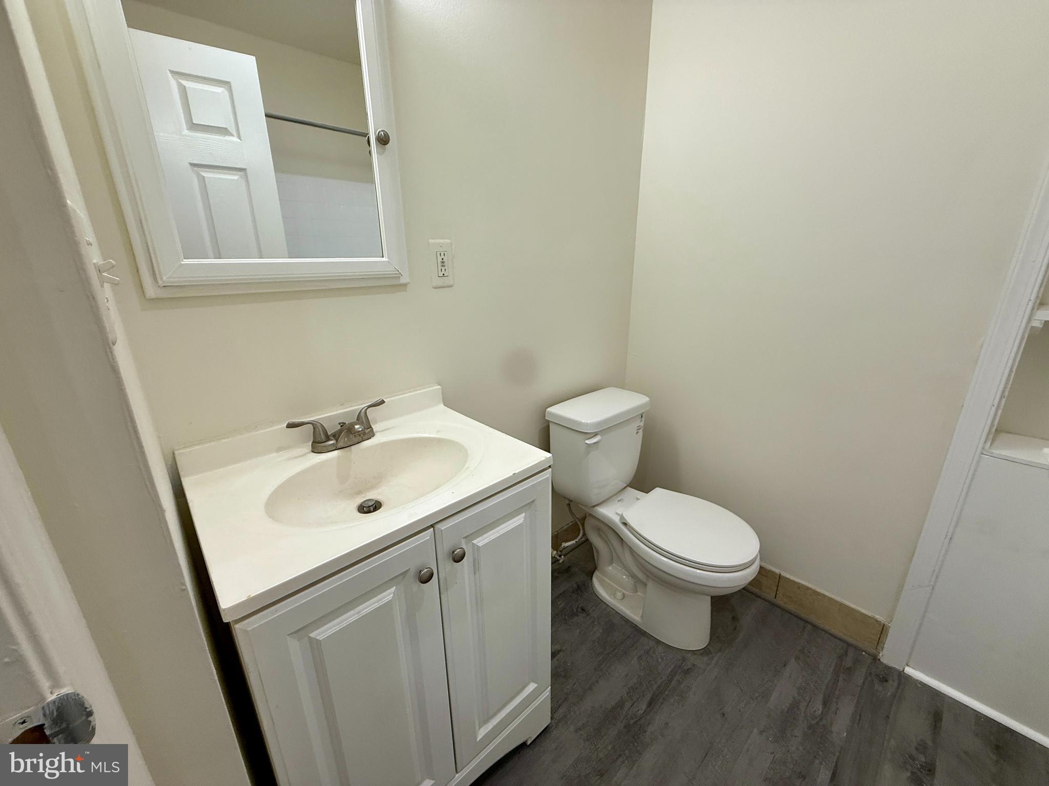 1908 M Street Northeast Washington, DC 20002 - Photo 9 of 20 a white toilet sitting next to a bathroom sink