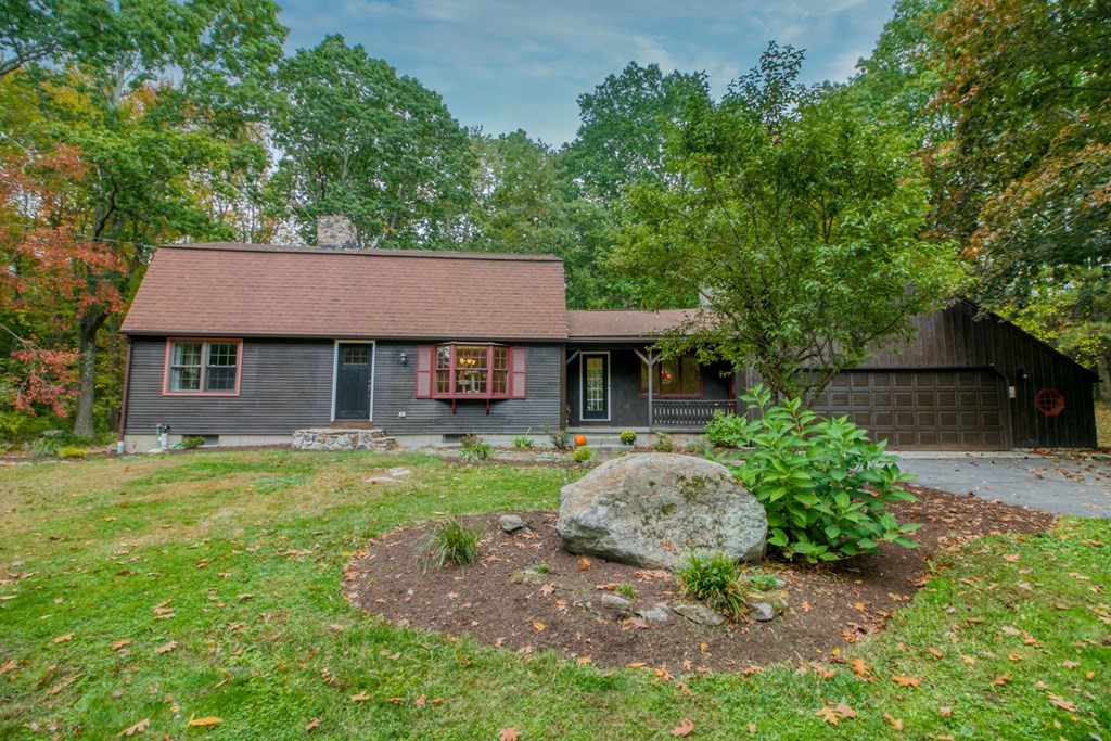 27 Thayer Road Monson, MA 01057 - Photo 1 of 39 a front view of a house with a yard and trees