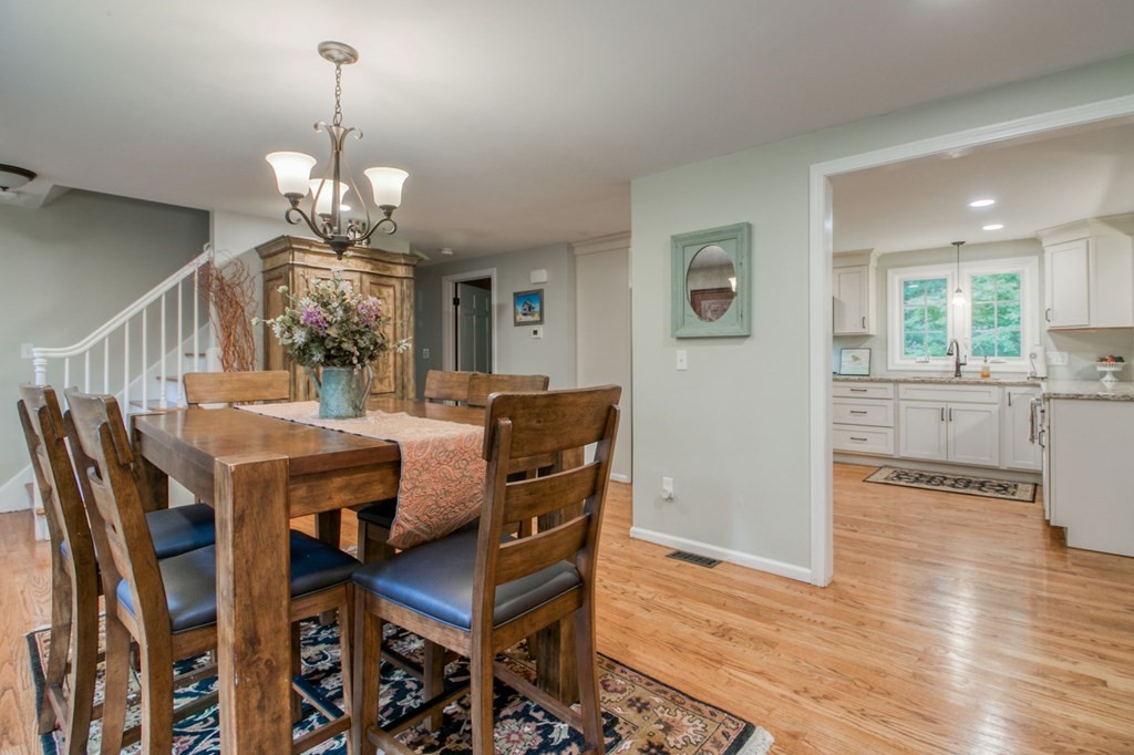 27 Thayer Road Monson, MA 01057 - Photo 14 of 39 a view of a dining room with furniture wooden floor and chandelier