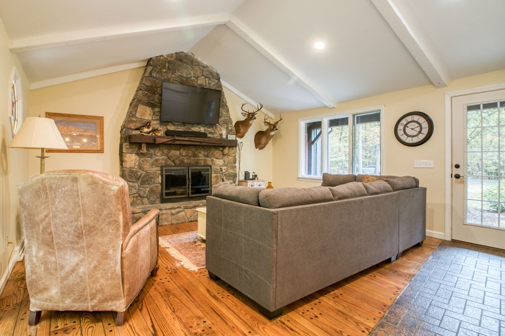 27 Thayer Road Monson, MA 01057 - Photo 16 of 39 a living room with furniture and a fireplace