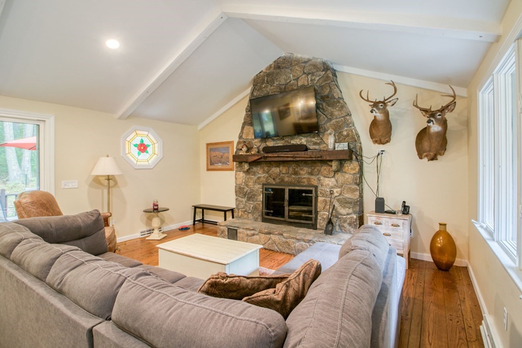 27 Thayer Road Monson, MA 01057 - Photo 17 of 39 a living room with furniture and a fireplace