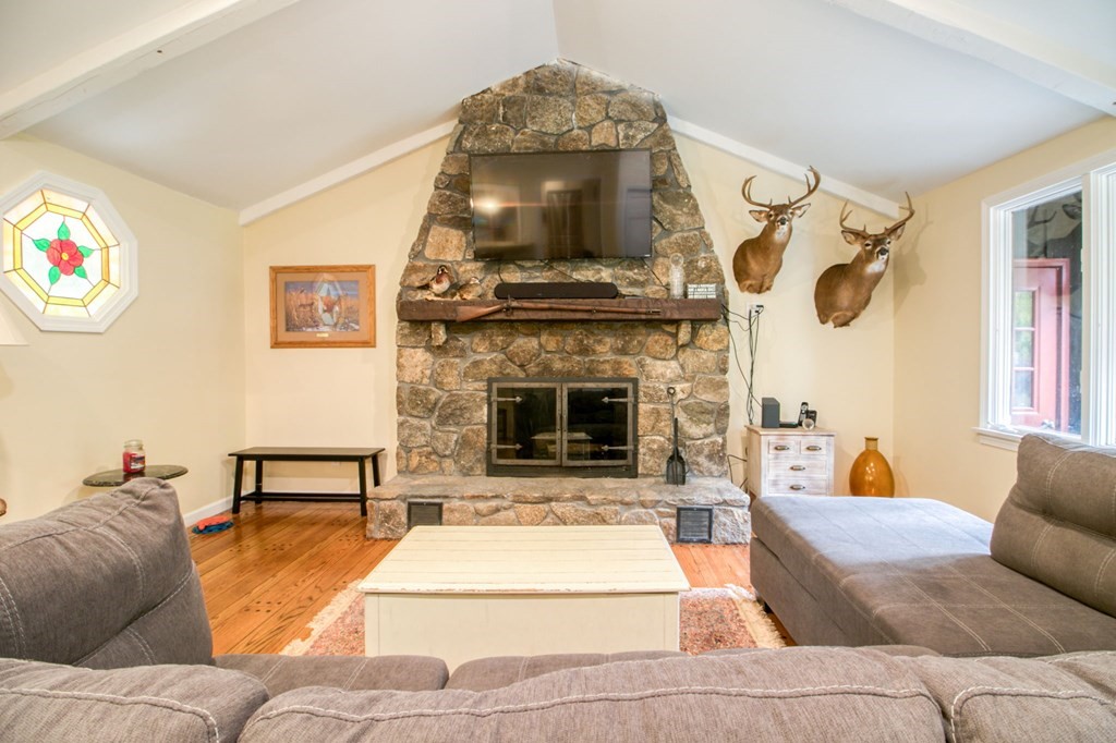 27 Thayer Road Monson, MA 01057 - Photo 18 of 39 a living room with furniture and a fireplace