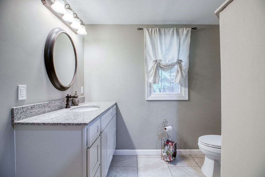 27 Thayer Road Monson, MA 01057 - Photo 21 of 39 a bathroom with a toilet a sink and a mirror