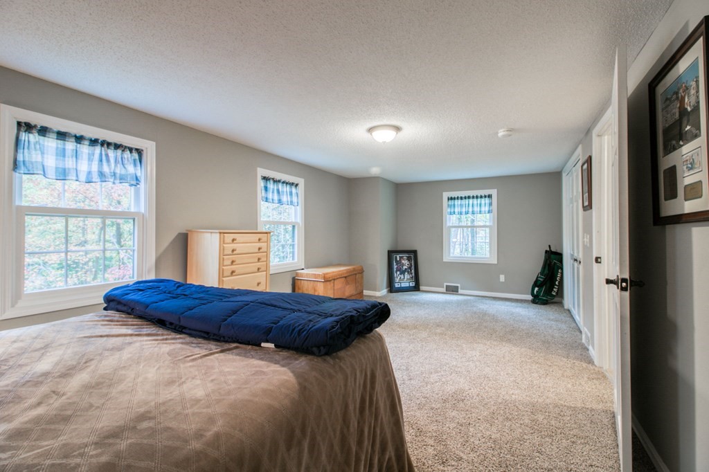 27 Thayer Road Monson, MA 01057 - Photo 25 of 39 a bedroom with a bed and a window