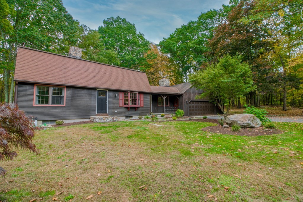 27 Thayer Road Monson, MA 01057 - Photo 5 of 39 a front view of a house with a garden