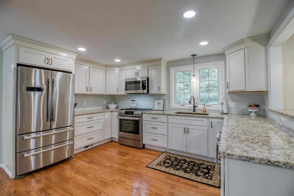 27 Thayer Road Monson, MA 01057 - Photo 8 of 39 a kitchen with granite countertop a stove sink and refrigerator