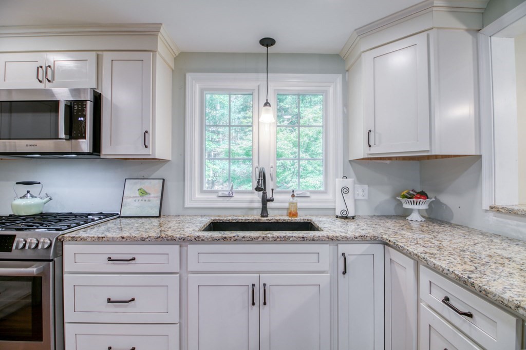 27 Thayer Road Monson, MA 01057 - Photo 10 of 39 a kitchen with granite countertop a sink and a window