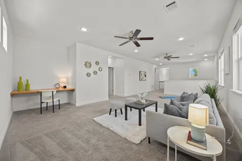 a living room with furniture and a window