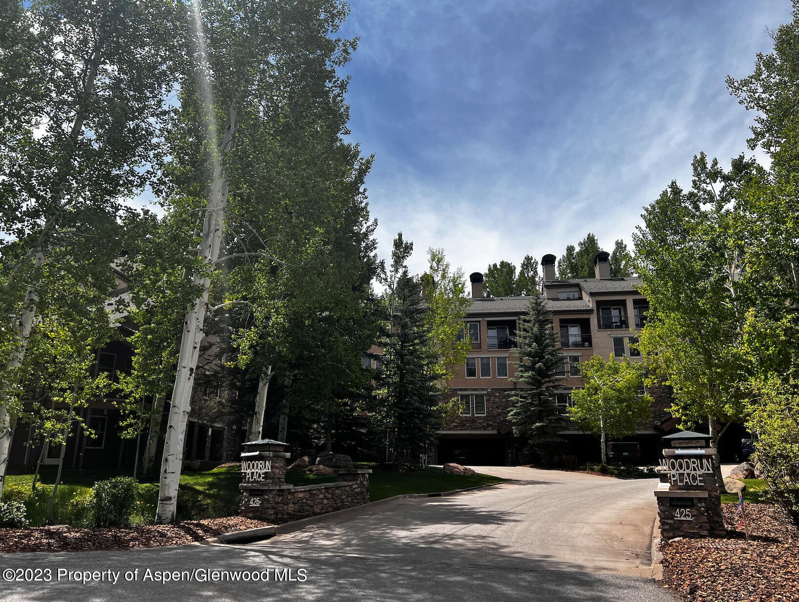 425 Wood Road, Unit 6 Snowmass Village, CO 81615 - Photo 1 of 29 a front view of a house with garden