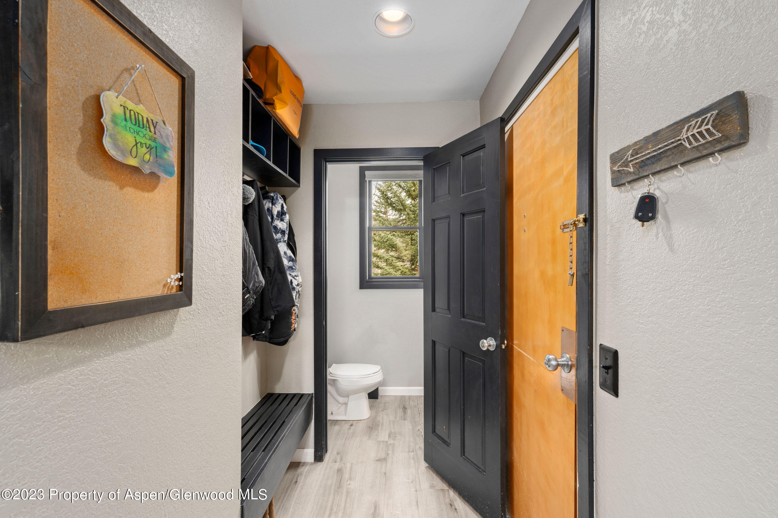 425 Wood Road, Unit 6 Snowmass Village, CO 81615 - Photo 14 of 29 a view of a hallway with wooden floor and a bathroom