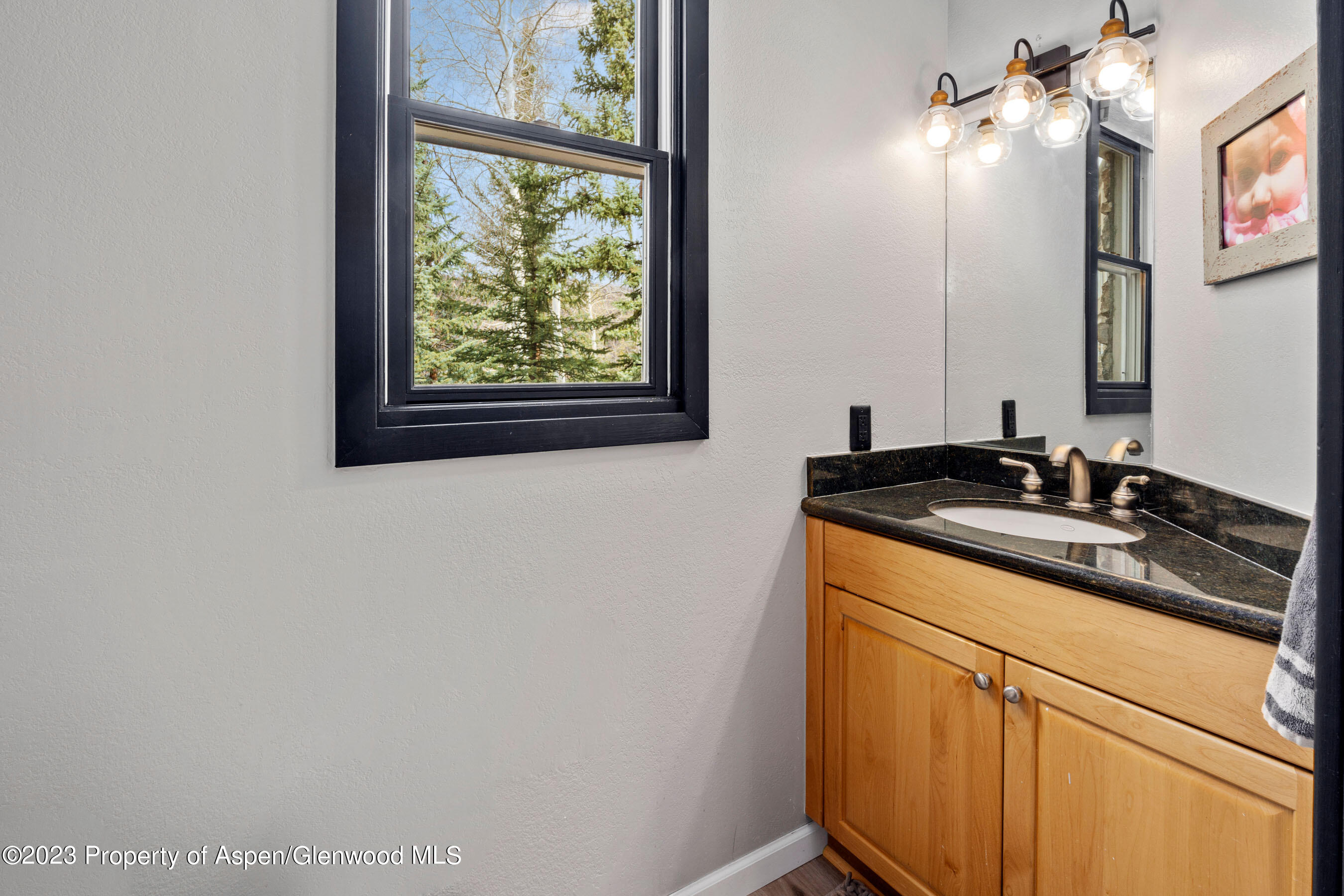 425 Wood Road, Unit 6 Snowmass Village, CO 81615 - Photo 15 of 29 a bathroom with a sink and a mirror