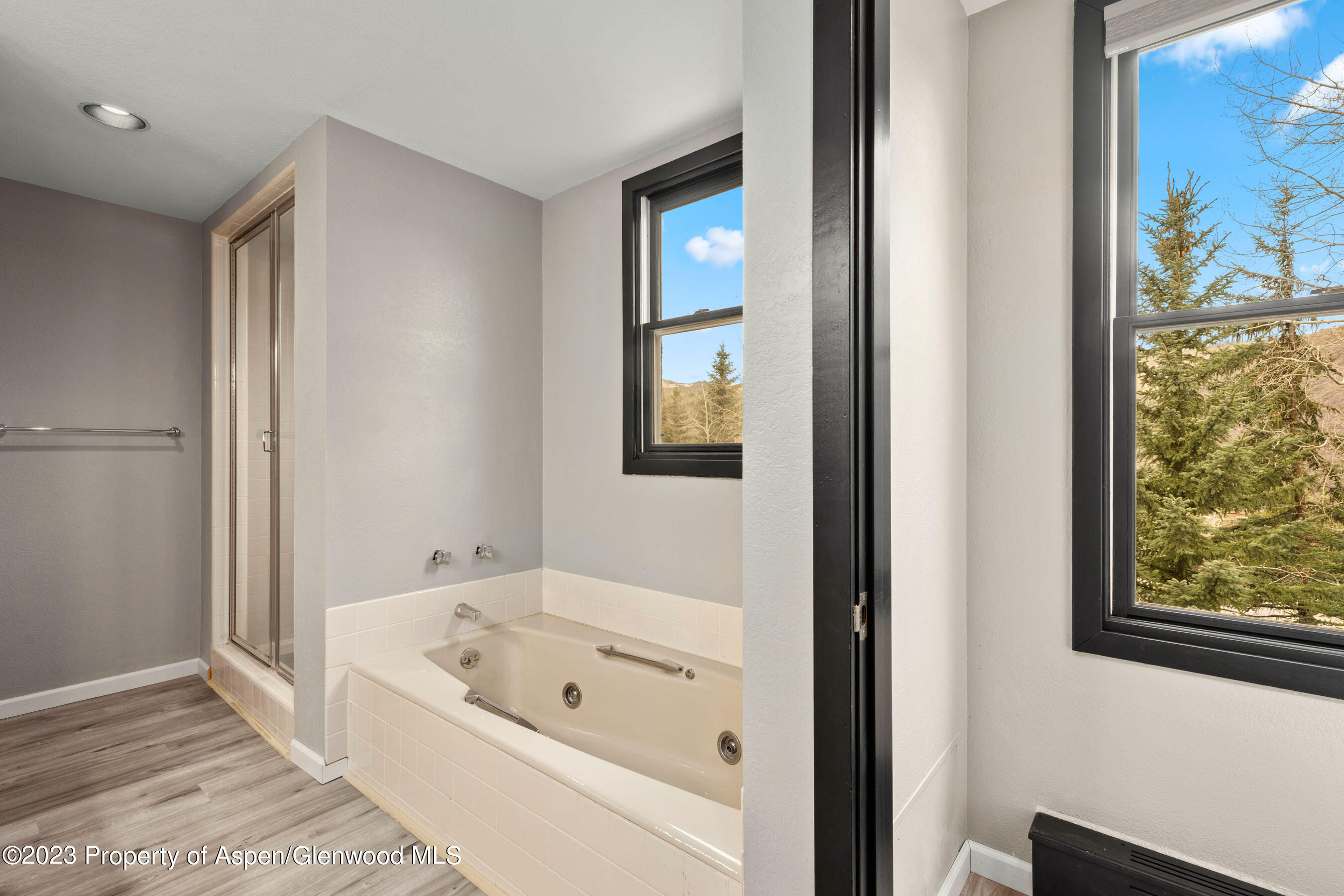 425 Wood Road, Unit 6 Snowmass Village, CO 81615 - Photo 18 of 29 a bathroom with a bathtub and a window