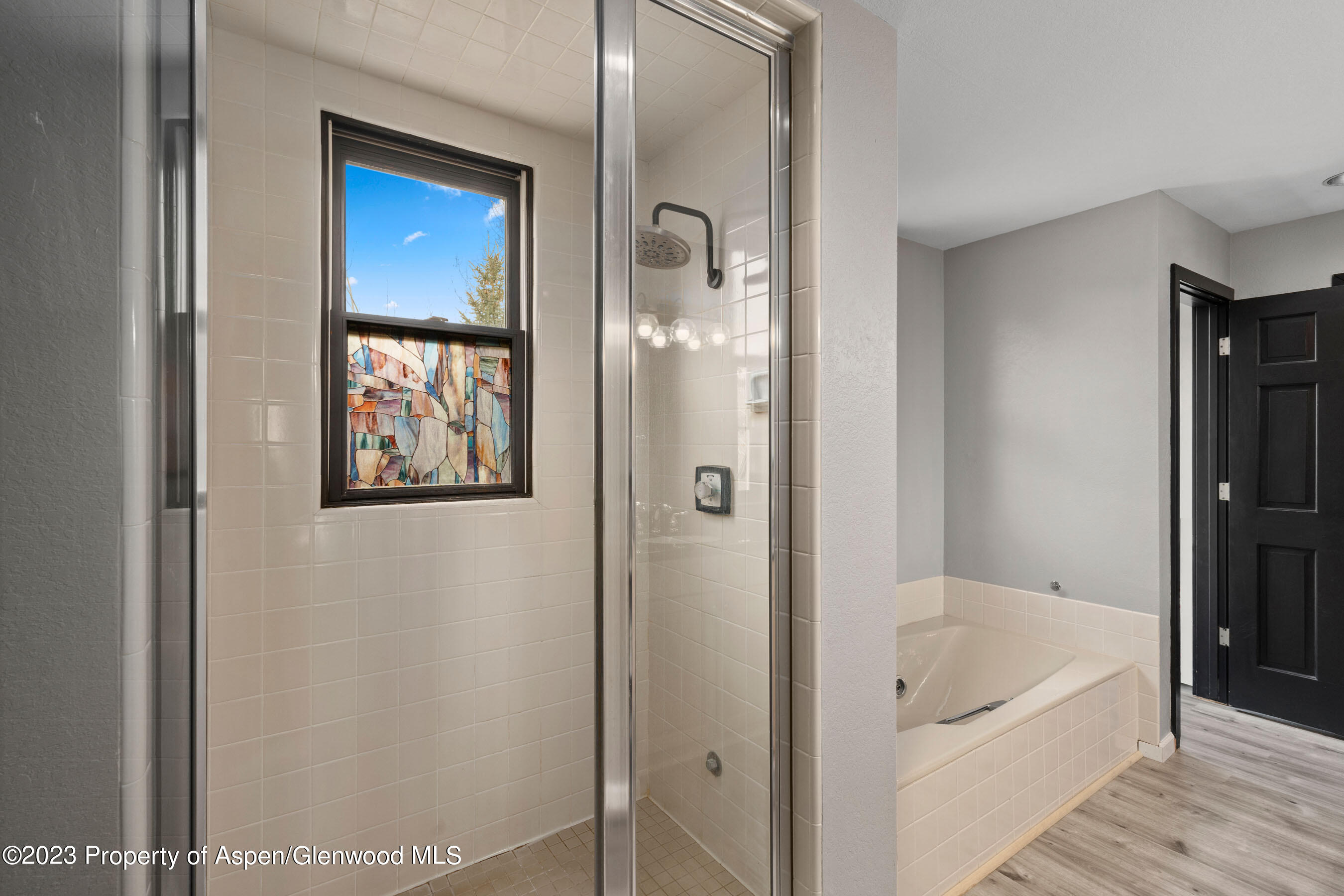 425 Wood Road, Unit 6 Snowmass Village, CO 81615 - Photo 20 of 29 a bathroom with a bathtub and a shower